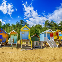 Buy canvas prints of Coloured Beach Huts  by Chris Thaxter