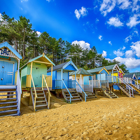 Buy canvas prints of  Coloured Beach Huts 2 by Chris Thaxter