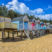 Buy canvas prints of  Coloured Beach Huts 3 by Chris Thaxter