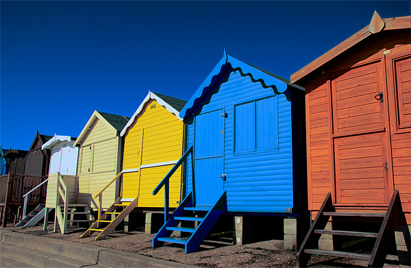Beach Huts at Frinton Essex Picture Board by Chris Thaxter
