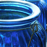 Buy canvas prints of blue glass jars by Heather Newton