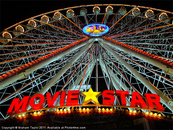 Colourful Nightscape of Ferris Wheel in Global Vil Picture Board by Graham Taylor
