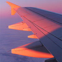 Buy canvas prints of Warm Glow of Sun Rise on Airplane Wing by Mark Purches
