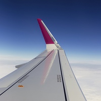 Buy canvas prints of Airplane Window Seat View Over Wing Whilst Flying by Mark Purches