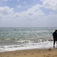Buy canvas prints of Fisherman on Sandown Beach Isle of Wight by Mark Purches