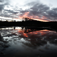 Buy canvas prints of Fiery Sunset Reflection & Floods After Storm Imoge by Mark Purches