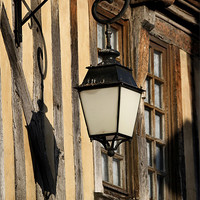 Buy canvas prints of Street Light On A Medieval House- Orbec - France by Samantha Higgs
