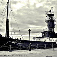 Buy canvas prints of Lighthouse boat by Sean Wareing
