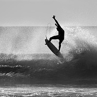 Buy canvas prints of Silhouetted Surfer at Dawn by peter tachauer