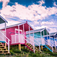 Buy canvas prints of Beach Huts On The Isle Of Sheppey by Dawn O'Connor