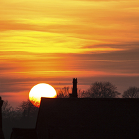 Buy canvas prints of Rooftop Sunset by Dawn O'Connor