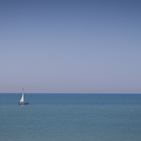 Buy canvas prints of  A Lonely Yacht out at Sea by Dawn O'Connor