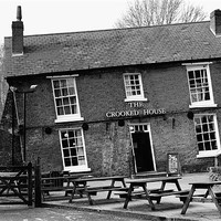 Buy canvas prints of The Crooked House Pub - Black And White  by Anthony Michael 