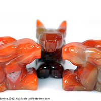 Buy canvas prints of Red Agate Carved Rabbits by Serena Bowles