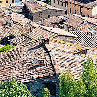 Buy canvas prints of Colle di Val d'Elsa roofs by Geoff Storey