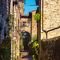 Buy canvas prints of Narrow Street in Colle di Val d'Elsa by Geoff Storey