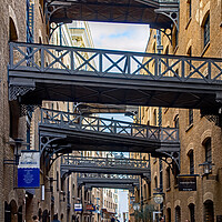 Buy canvas prints of The Street with Bridges by Joyce Storey