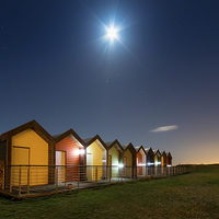 Buy canvas prints of  Blyth Beach Huts under a Christmas Eve Moon by Paul Appleby