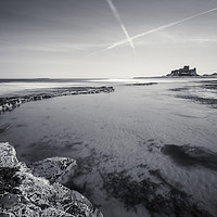 Buy canvas prints of Bamburgh Castle and Contrails by Paul Appleby