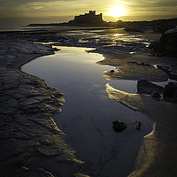 Buy canvas prints of Bamburgh Castle & beach  - December Sunrise by Paul Appleby