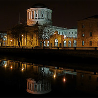 Buy canvas prints of The Four Courts along the River Liffey by Thomas Stroehle