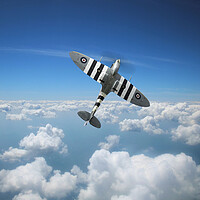 Buy canvas prints of Spitfire In The Clouds by J Biggadike