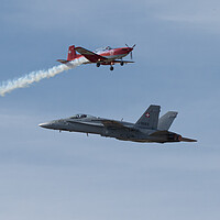 Buy canvas prints of F18 Hornet and Swiss PC-7 Team by J Biggadike