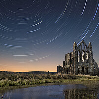 Buy canvas prints of Whitby Abbey Star Trails by J Biggadike