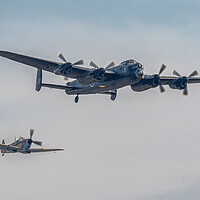 Buy canvas prints of Lancaster and Spitfire by J Biggadike