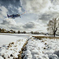 Buy canvas prints of Spitfire Snowbound by J Biggadike