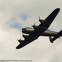 Buy canvas prints of Backlit Lancaster Bomber by J Biggadike