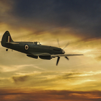Buy canvas prints of Spitfire  PS915 Sunset by J Biggadike