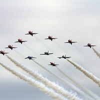 Buy canvas prints of Red Arrows 50th anniversary flypast by J Biggadike
