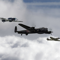 Buy canvas prints of Lancaster Spitfire and Hurricane by J Biggadike