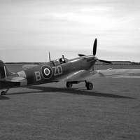 Buy canvas prints of Spitfire at Duxford  by J Biggadike