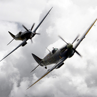 Buy canvas prints of Spitfire Tail Chase  by J Biggadike