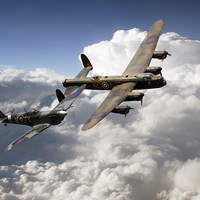 Buy canvas prints of Lancaster and Spitfire  by J Biggadike