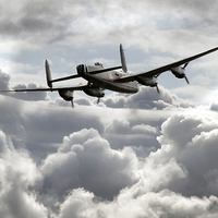 Buy canvas prints of Lancaster In The Clouds  by J Biggadike