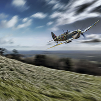 Buy canvas prints of Supermarine Spitfire Fly Past by J Biggadike