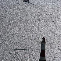 Buy canvas prints of XH558 Over The Lighthouse by J Biggadike