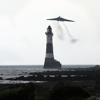Buy canvas prints of Vulcan And The Lighthouse by J Biggadike