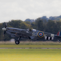 Buy canvas prints of Spitfire MK356 Landing by J Biggadike