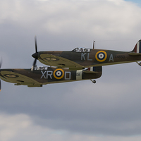 Buy canvas prints of Spitfire Duo by J Biggadike