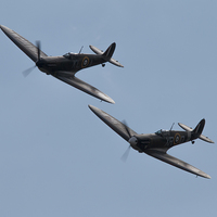 Buy canvas prints of Here Come The Spitfires by J Biggadike