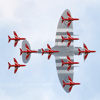 Buy canvas prints of Red Arrows Spitfire Formation by J Biggadike