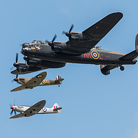 Buy canvas prints of BBMF Lancaster and Spitfires by J Biggadike