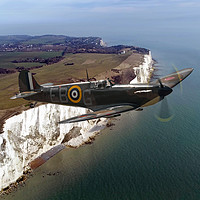 Buy canvas prints of Supermarine Spitfire P7350 Over The Cliffs by J Biggadike