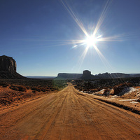 Buy canvas prints of  Monument Valley sun flare by Matthew Bates