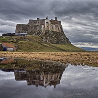 Buy canvas prints of  Lindisfarne Castle by John Biggadike