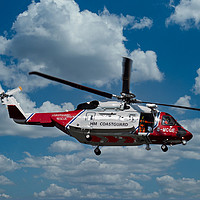 Buy canvas prints of HM Coastguard rescue helicopter. by John Biggadike